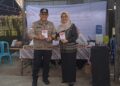 Serasi, Pj Bupati Bartim Didampingi Istri Nyoblos di TPS 01 Tamiang Layang