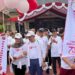 Semarak Hari Bhayangkara ke-79, Pj Bupati Barito Utara Ikuti Jalan Sehat Bersama Masyarakat
