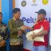 Ketua DPRD Murung Raya, Rumiadi, S.Sos, menghadiri peluncuran program bantuan pangan beras dan minyak goreng di halaman Perum Bulog Puruk Cahu, Kamis (13/11/2025).