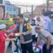 Kapolres Bartim, AKBP Eddy Santoso, yang terlibat langsung dalam aksi sosial komunitas Nansarunai Scooter, Jumat (13/3/2026).