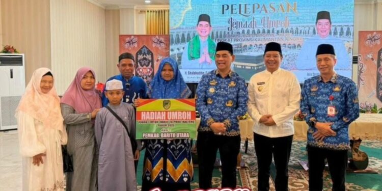 Bupati Barito Utara, Shalahuddin, dan Wabup, Felix Sonadie Y. Tingan, berpose dengan juara MTQH XXXIII.