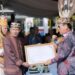 Ketua DPRD Kalteng, Arton S Dohong, menerima gelar adat di HUT ke-69 Kalimantan Tengah, baru - baru tadi. (Ist)