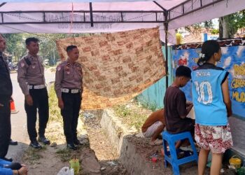 Pembuatan mural yang dilakukan jajaran Satlantas Polres Bartim di momen HUT ke-71 Lalu Lintas, Selasa (15/9/2026).