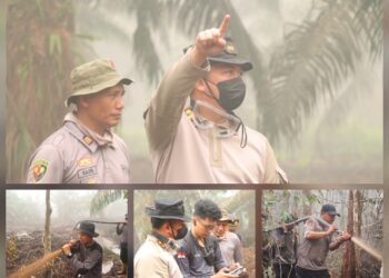 Kapolres Barito Timur AKBP Iqbal Sengaji bersama personel berjibaku padamkan api. (ist)